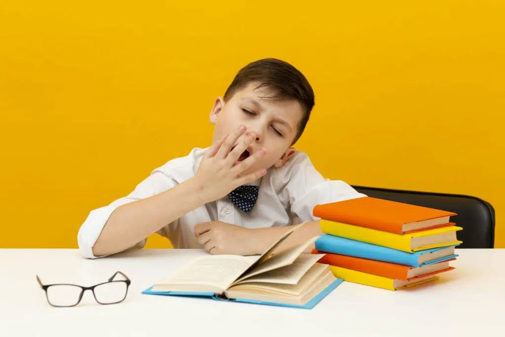 high angle sleepy boy reading 1 1 scaled 1